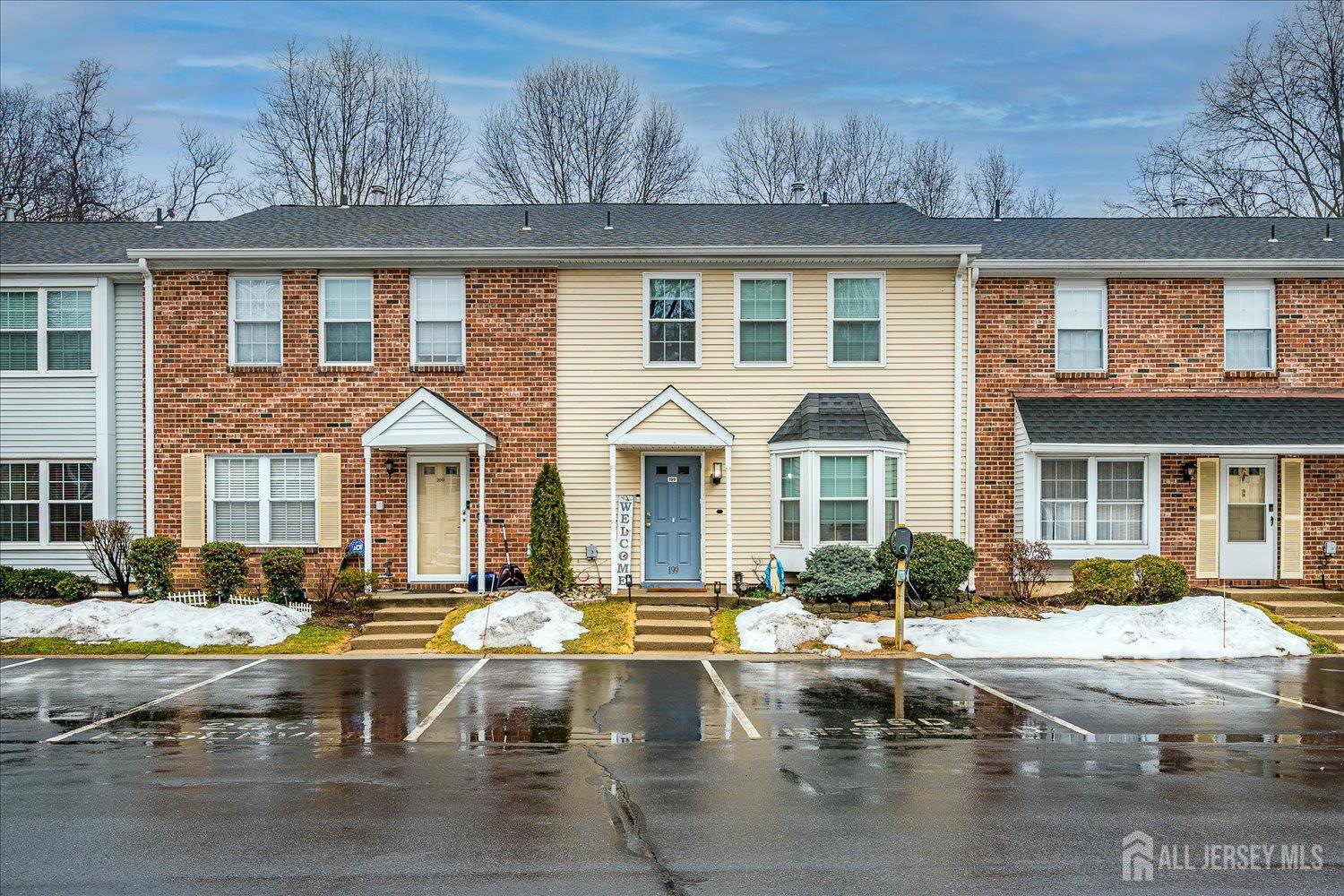 199 Applegate Lane East Brunswick, NJ 08816 - Photo 1 of 38 a view of a white building with swimming pool in front of it