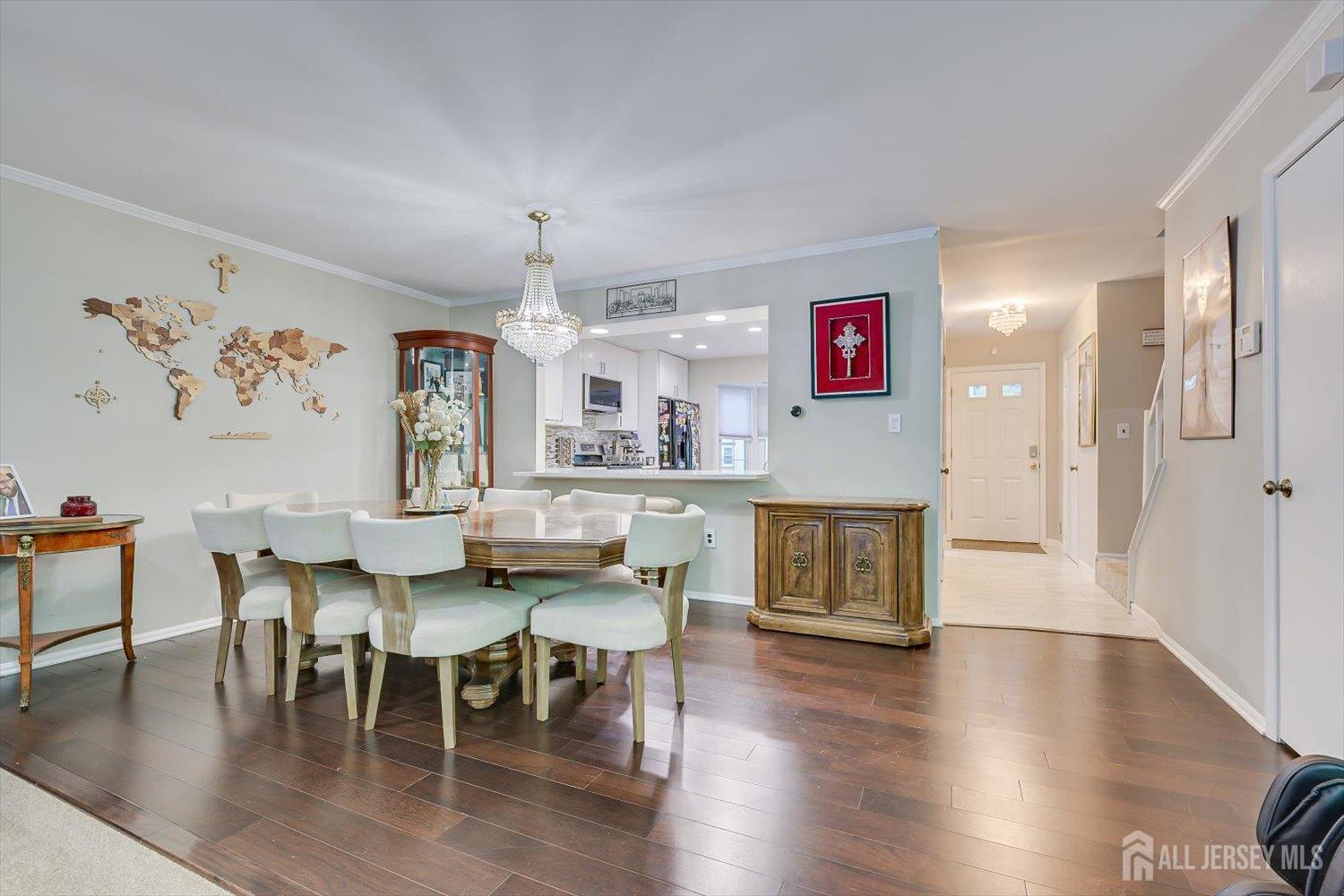 199 Applegate Lane East Brunswick, NJ 08816 - Photo 14 of 38 a view of a dining room with furniture and wooden floor