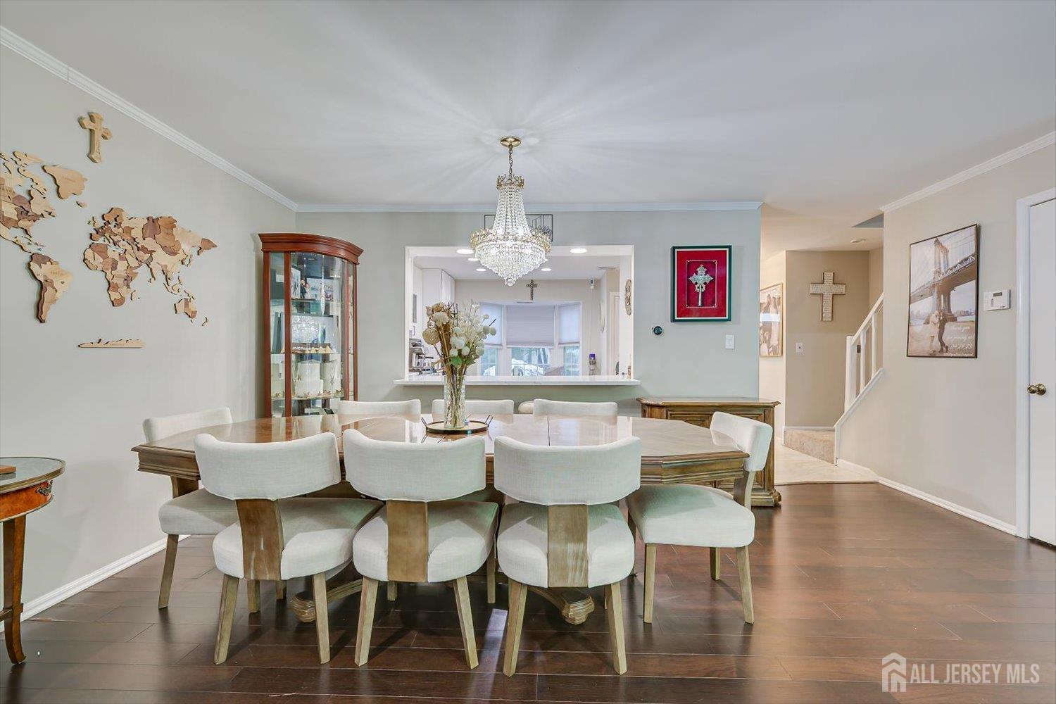 199 Applegate Lane East Brunswick, NJ 08816 - Photo 15 of 38 a view of a dining room with furniture wooden floor and chandelier