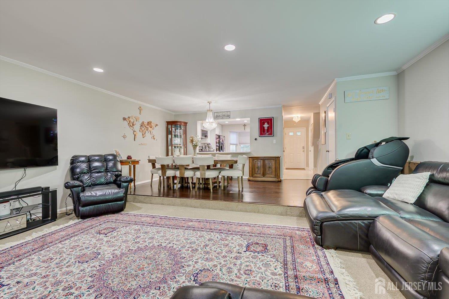 199 Applegate Lane East Brunswick, NJ 08816 - Photo 17 of 38 a living room with furniture and a flat screen tv