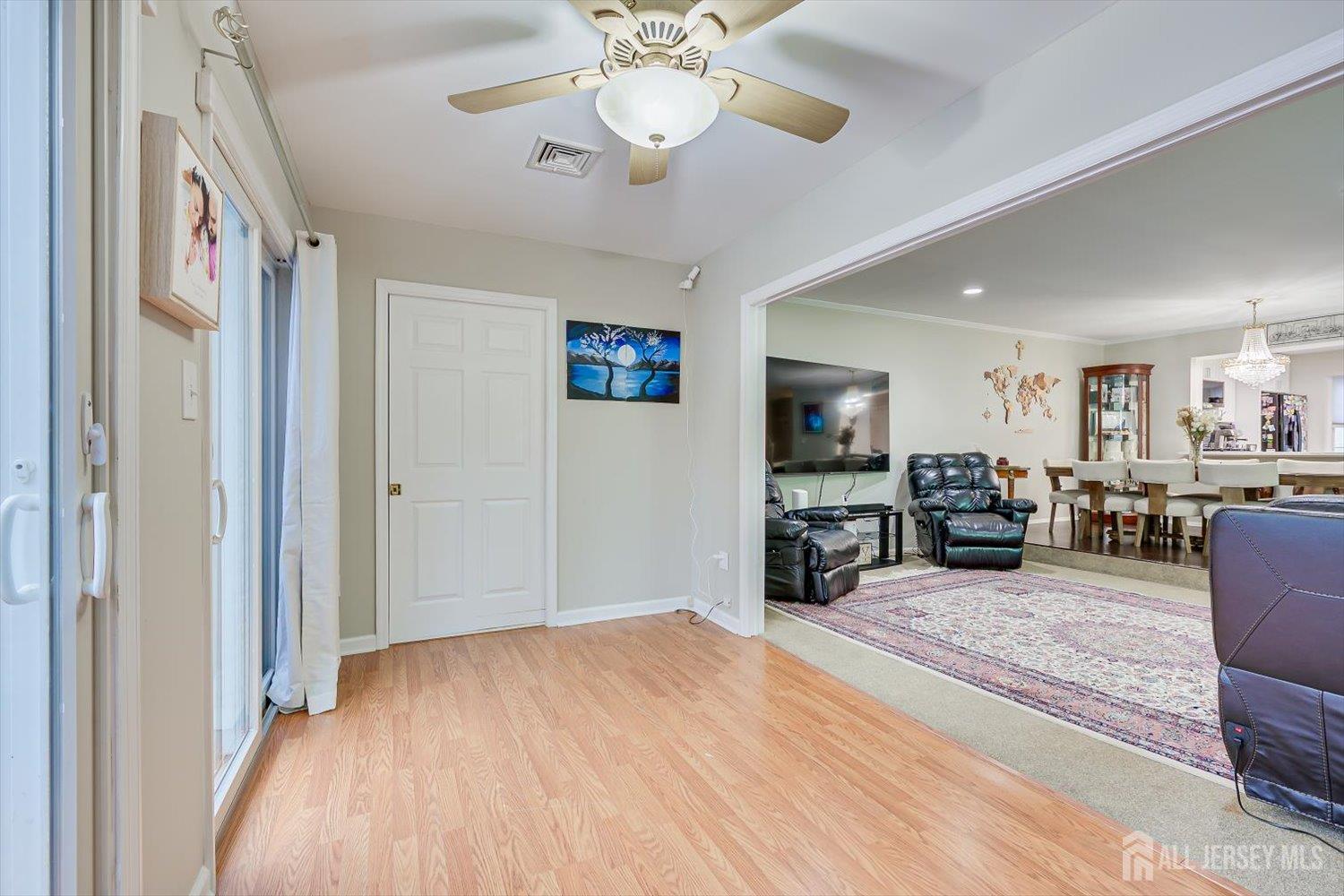 199 Applegate Lane East Brunswick, NJ 08816 - Photo 18 of 38 a view of a livingroom with furniture and a ceiling fan