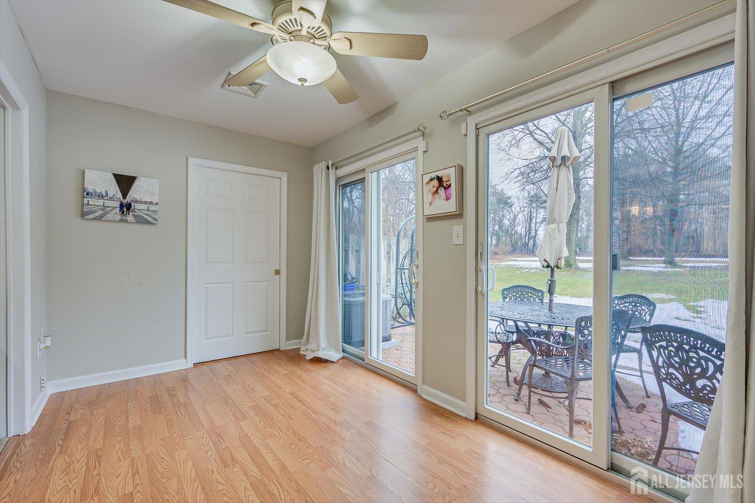 199 Applegate Lane East Brunswick, NJ 08816 - Photo 19 of 38 wooden floor in an empty room with a window