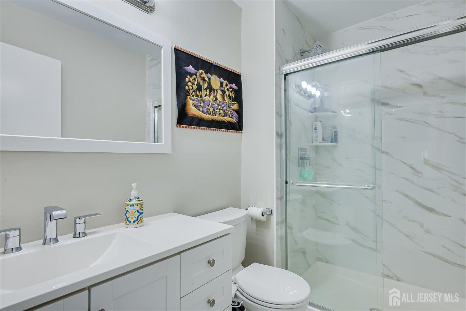 199 Applegate Lane East Brunswick, NJ 08816 - Photo 23 of 38 a bathroom with a sink a toilet and shower