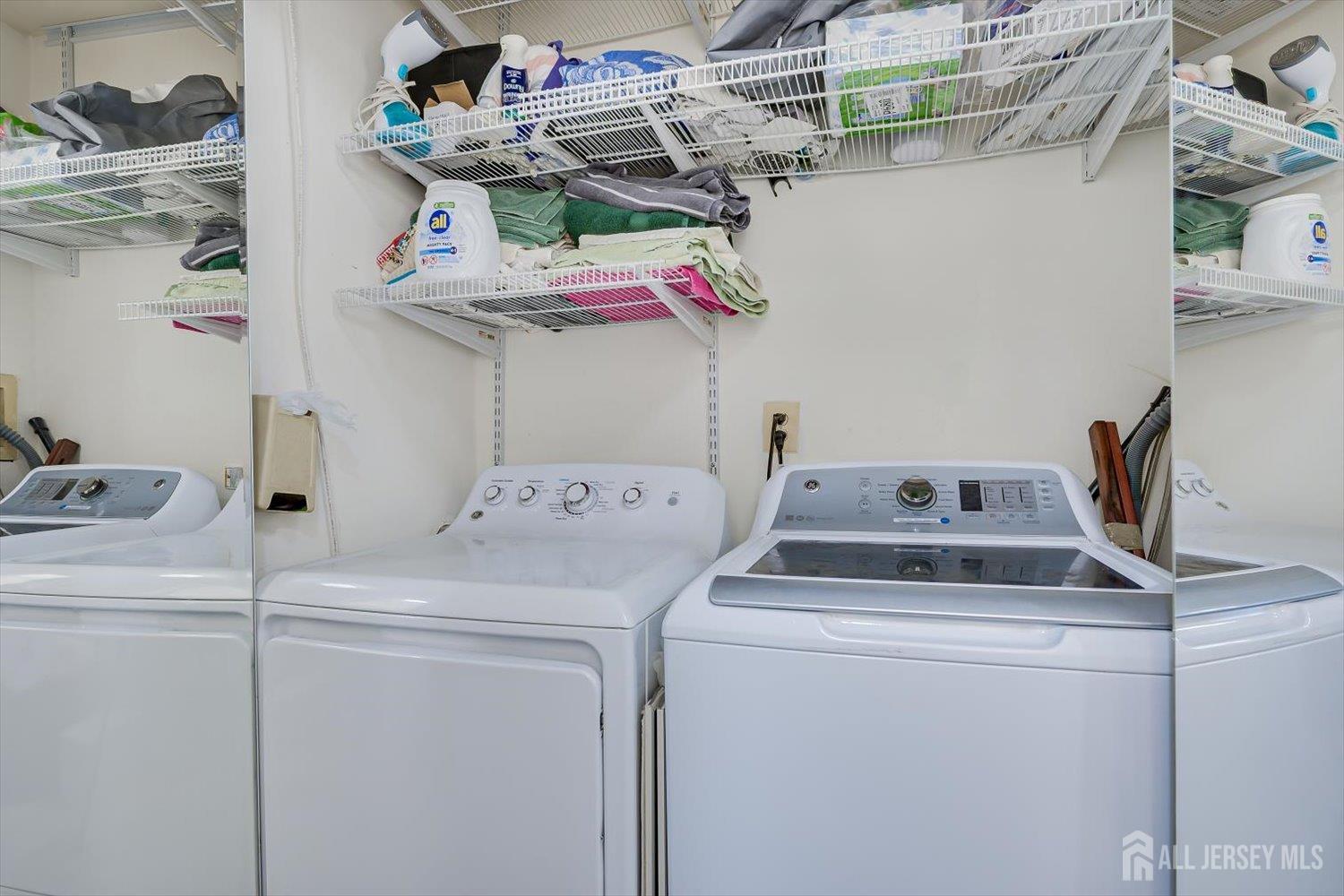 199 Applegate Lane East Brunswick, NJ 08816 - Photo 29 of 38 a utility room with dryer and washer