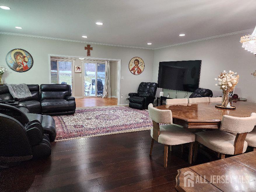199 Applegate Lane East Brunswick, NJ 08816 - Photo 33 of 38 a living room with furniture wooden floor and a flat screen tv