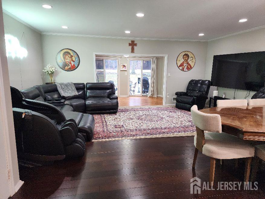 199 Applegate Lane East Brunswick, NJ 08816 - Photo 34 of 38 a living room with furniture and a flat screen tv