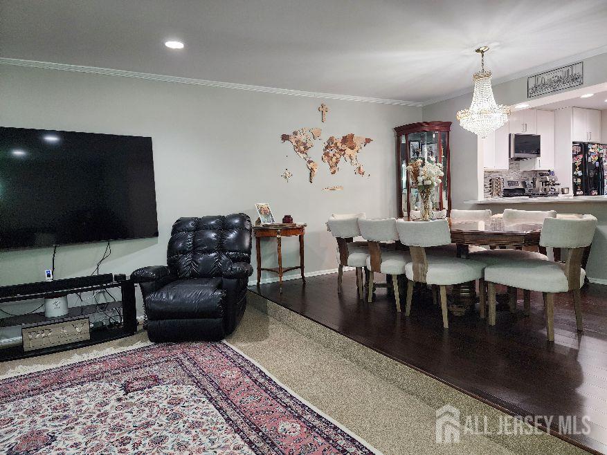 199 Applegate Lane East Brunswick, NJ 08816 - Photo 35 of 38 a living room with furniture and a flat screen tv