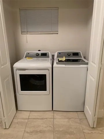 a utility room with washer and dryer