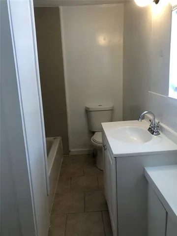 a bathroom with a sink and toilet
