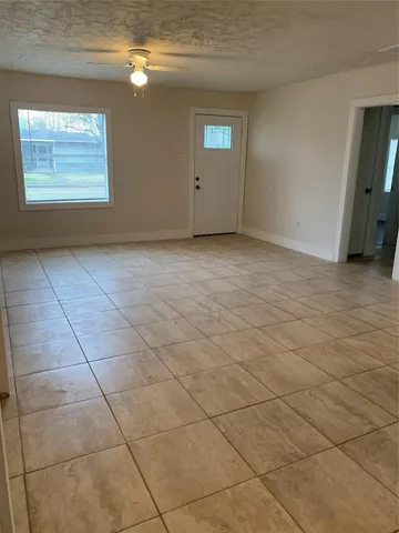 a view of an empty room and window