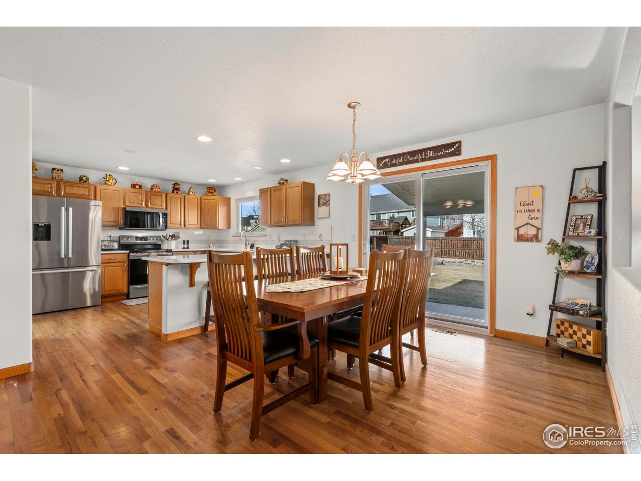 3012 54th Avenue Greeley, CO 80634 - Photo 12 of 33 a dining room with furniture and wooden floor