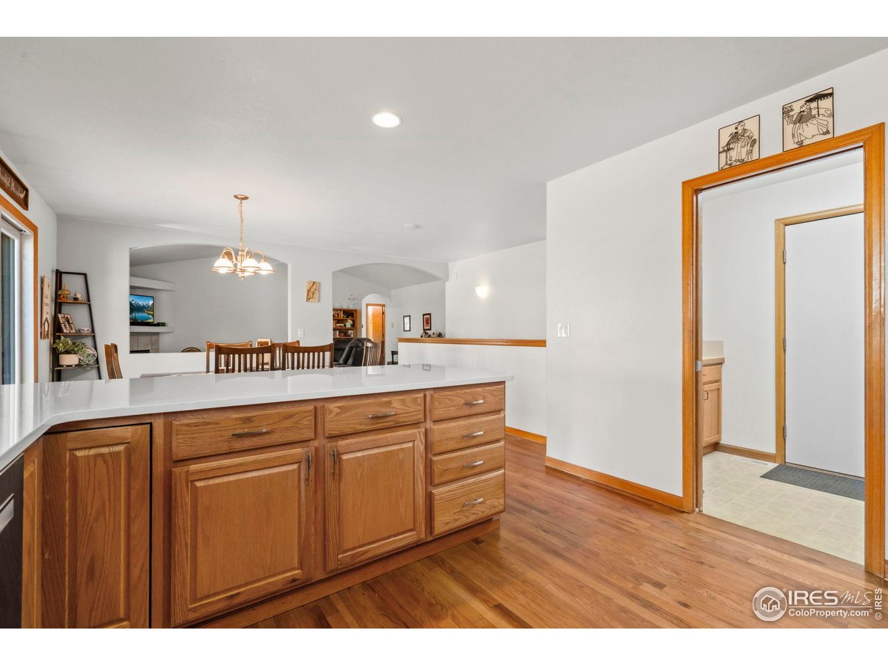 3012 54th Avenue Greeley, CO 80634 - Photo 14 of 33 a view of a kitchen cabinets and wooden floor