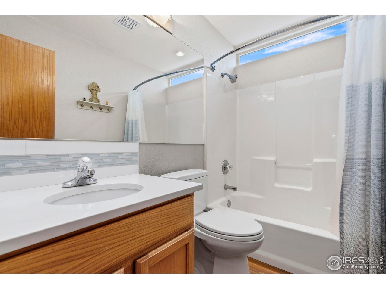 3012 54th Avenue Greeley, CO 80634 - Photo 20 of 33 a bathroom with a sink a toilet and shower