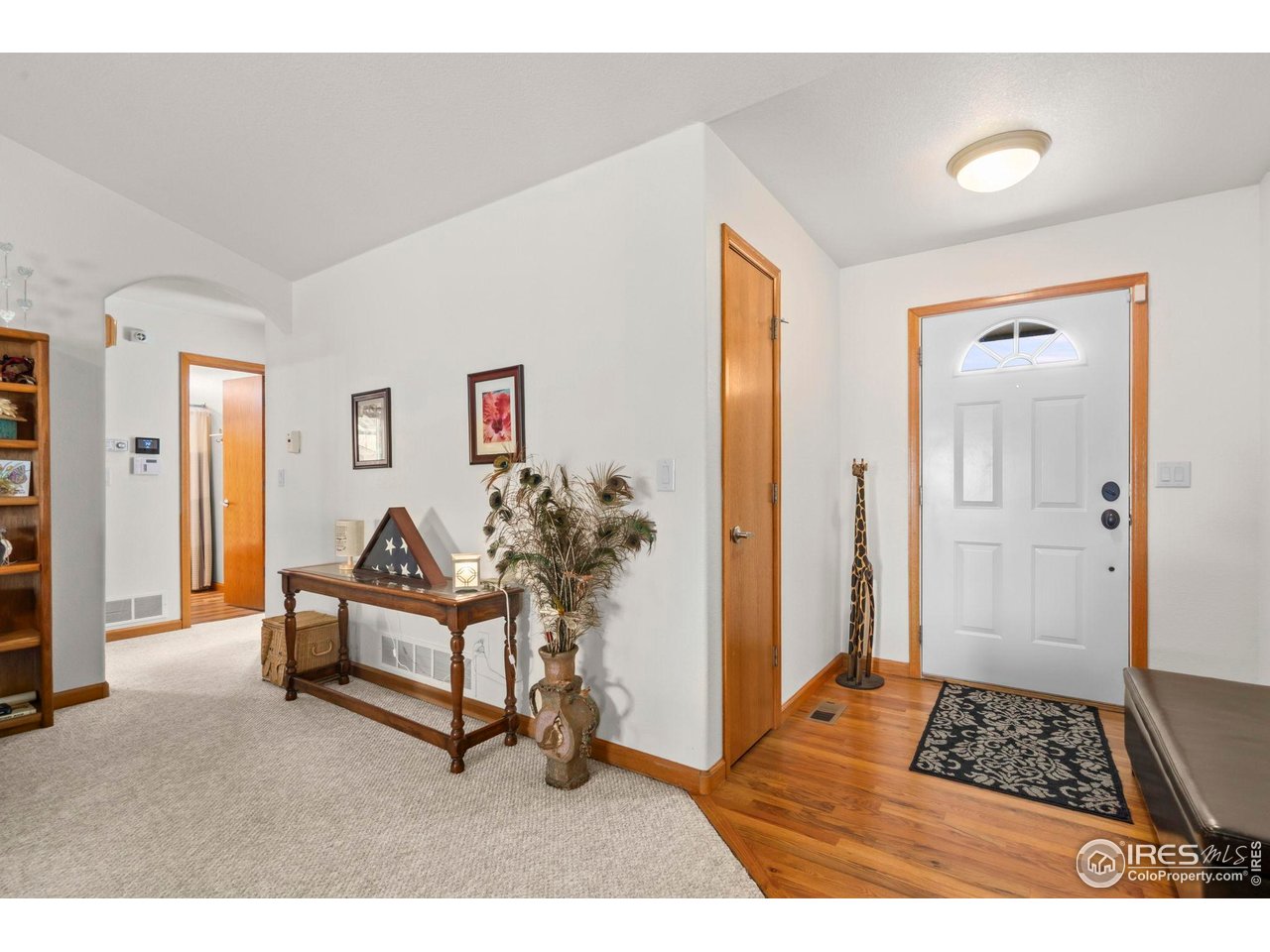 3012 54th Avenue Greeley, CO 80634 - Photo 9 of 33 a living room with furniture and a rug