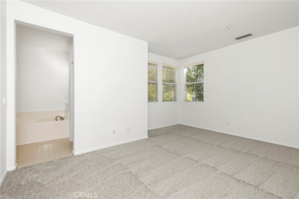 4 Toribeth Street, Unit 8 Ladera Ranch, CA 92694 - Photo 9 of 26 Large guest bedrooms with new carpet throughout.