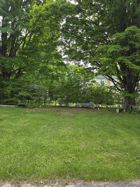 48 Maple Street, Unit 2 Holden, MA 01520 - Photo 10 of 11 a view of a field of grass and trees