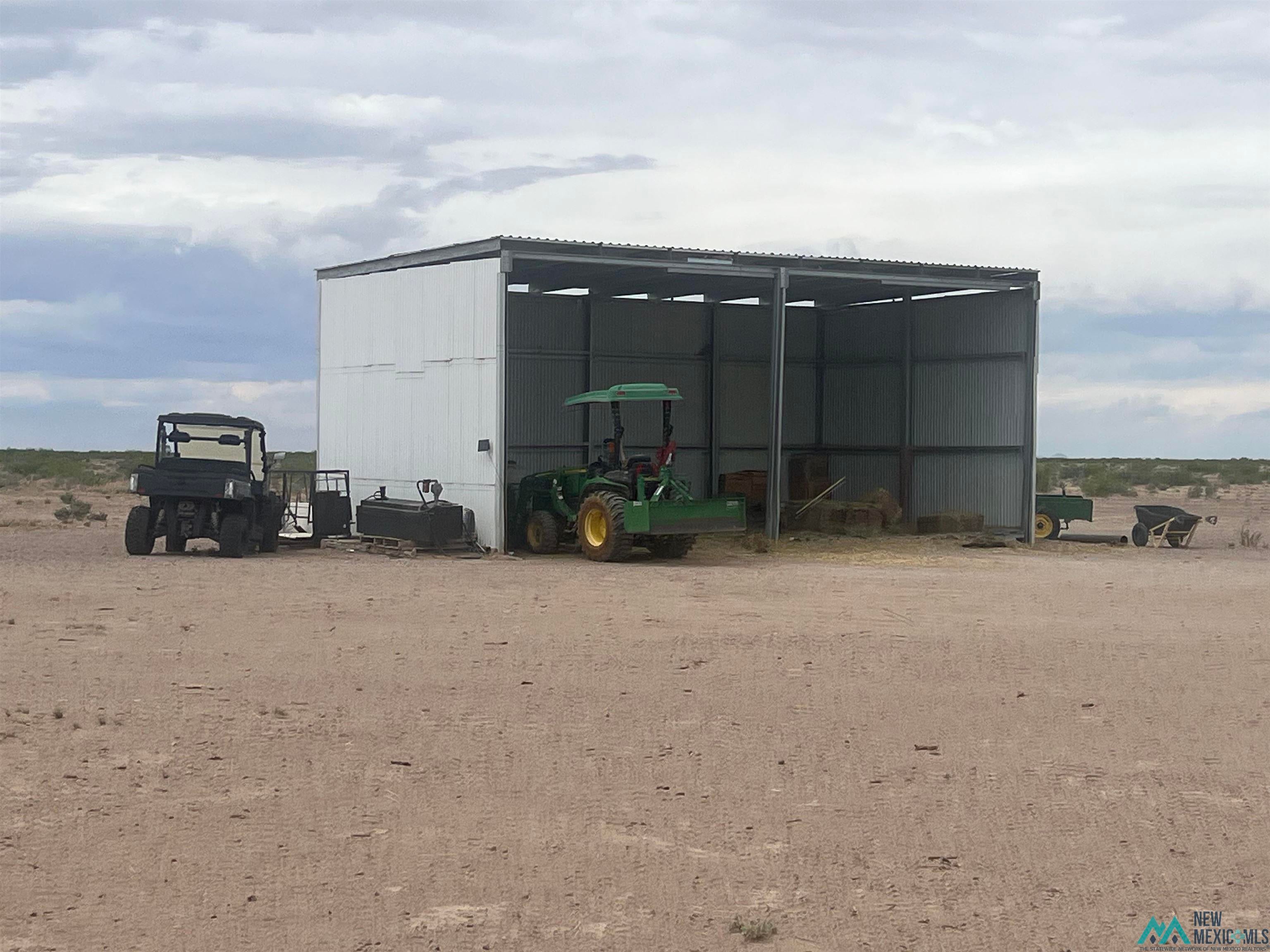 14006 Ciguena Road Southwest Deming, NM 88030 - Photo 35 of 49 View of pole building with a detached carport