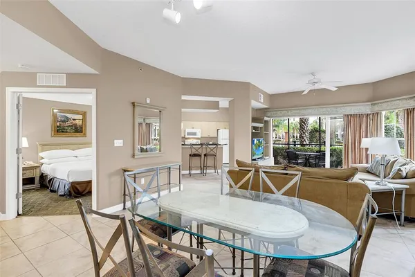 a view of a dining room with furniture wooden floor and chandelier