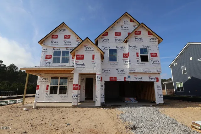 a front view of a building with many windows