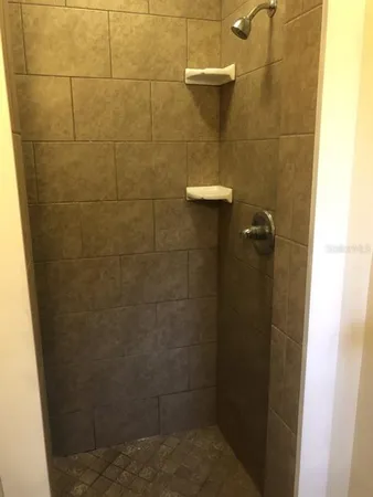 a bathroom with a toilet a sink and a window