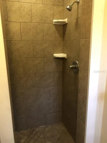 a bathroom with a toilet a sink and a window