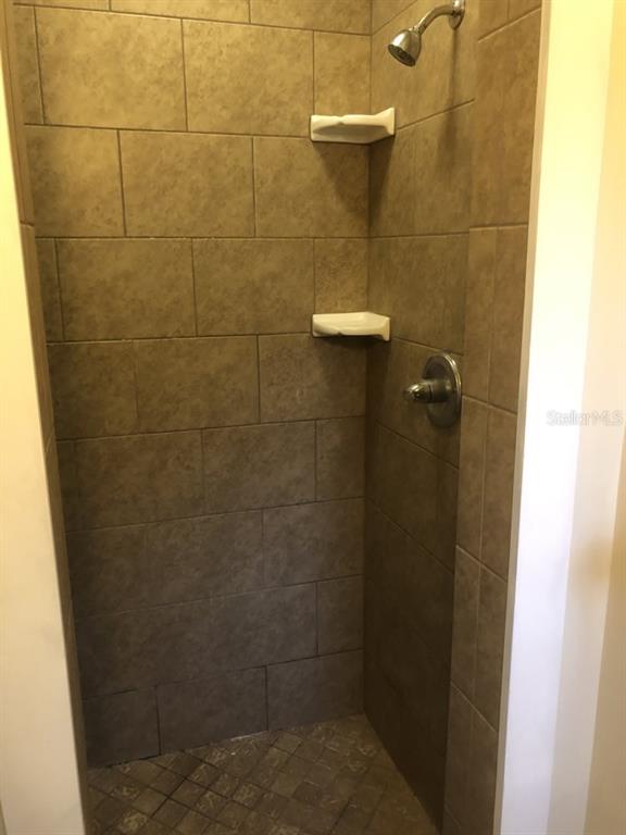 527 Northwest 36th Terrace Gainesville, FL 32607 - Photo 12 of 17 a bathroom with a shower