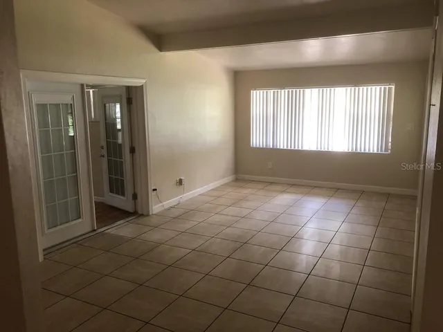 a view of an empty room and window