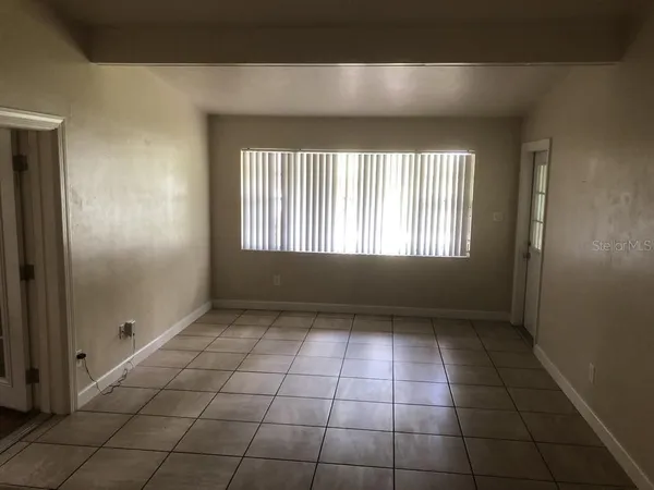 a view of an empty room and window