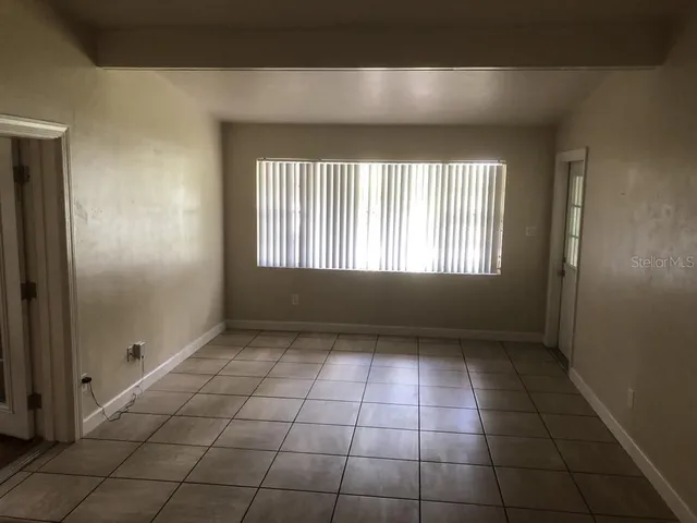 a view of an empty room and window