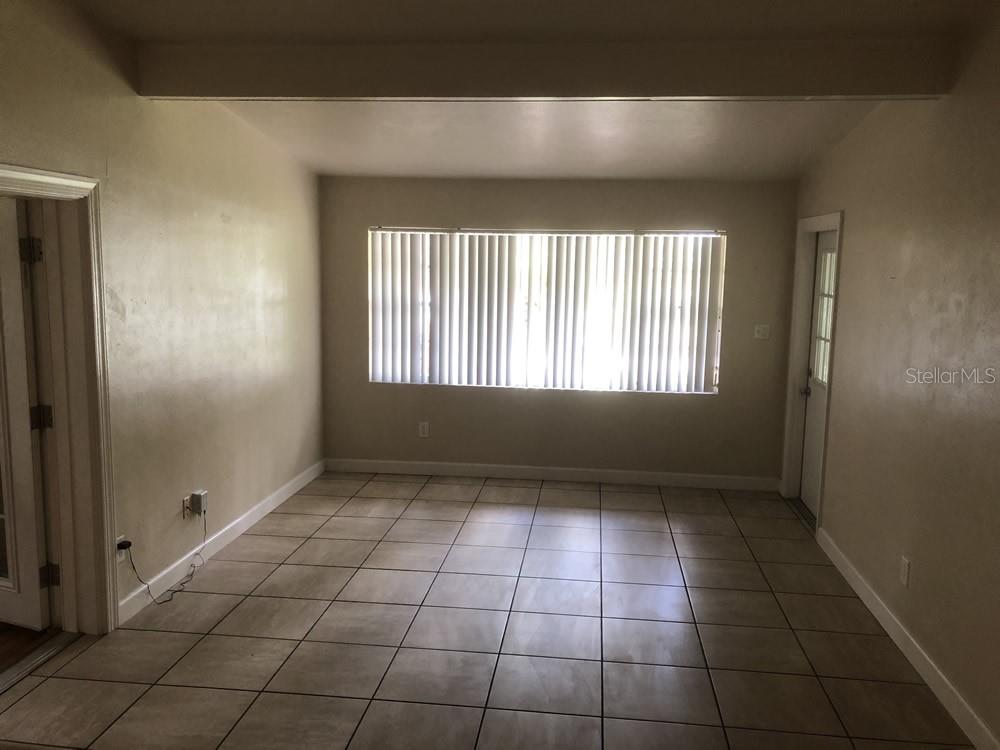 527 Northwest 36th Terrace Gainesville, FL 32607 - Photo 4 of 17 a view of an empty room and window