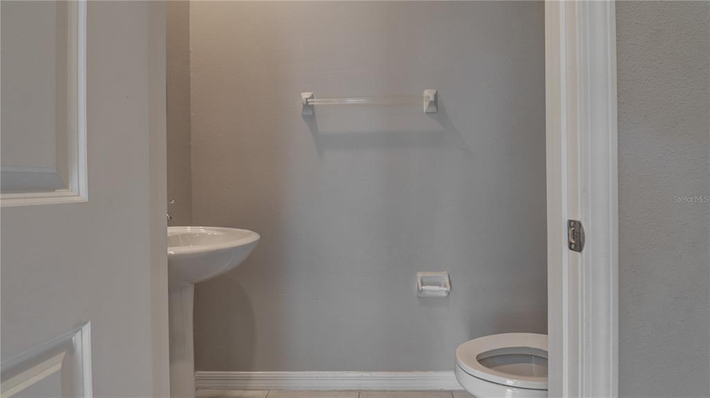 31632 Blue Passing Loop Wesley Chapel, FL 33545 - Photo 21 of 48 a bathroom with a toilet