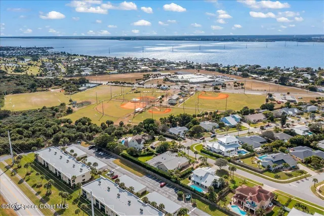 a view of a street sign with potted plants