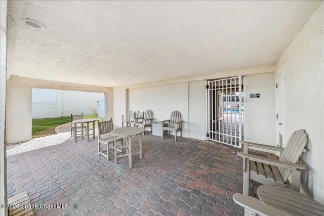 a view of a chairs and table in the patio
