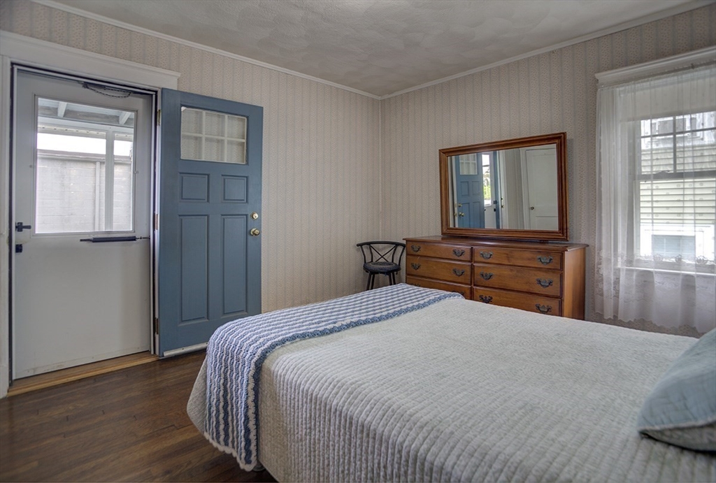 44 Cottage Park Road Winthrop, MA 02152 - Photo 11 of 39 a bedroom with a bed and a dresser