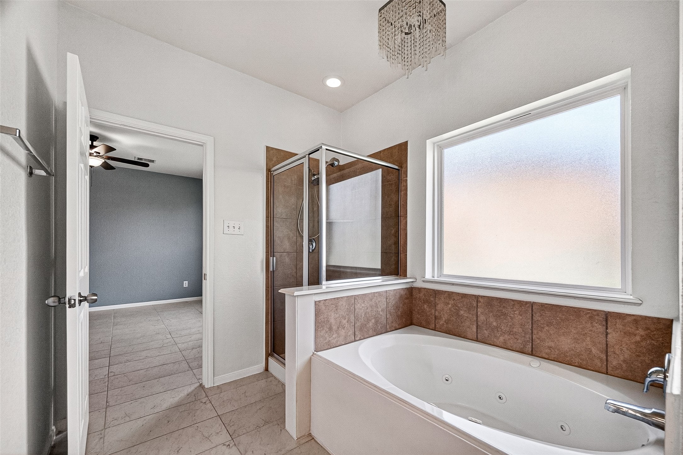 2702 Modano Court Fresno, TX 77545 - Photo 17 of 46 a bathroom with a bathtub and a shower