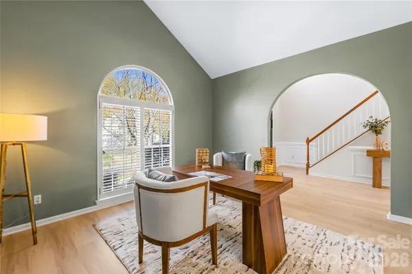 a view of a dining room with furniture window and wooden floor