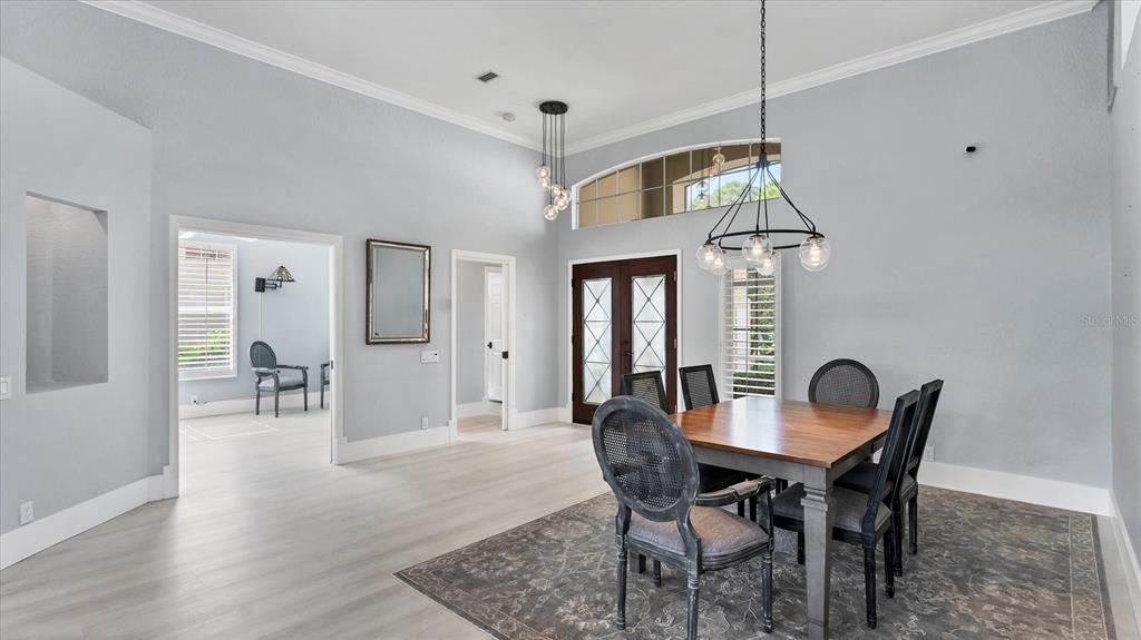 7217 Churston Lane University Park, FL 34201 - Photo 20 of 60 a view of a dining room with furniture and wooden floor