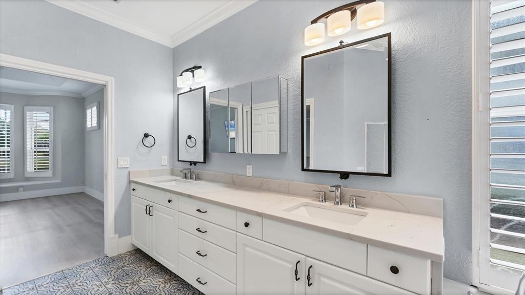 7217 Churston Lane University Park, FL 34201 - Photo 25 of 60 a bathroom with a double vanity sink and a mirror