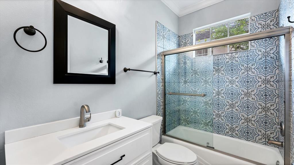 7217 Churston Lane University Park, FL 34201 - Photo 29 of 60 a bathroom with a granite countertop sink toilet and mirror