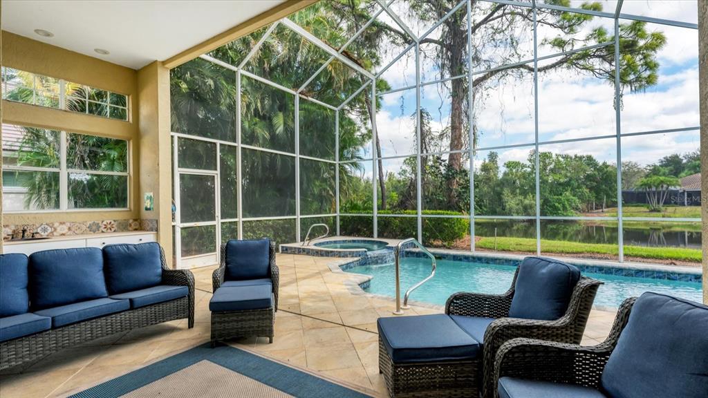 7217 Churston Lane University Park, FL 34201 - Photo 31 of 60 a view of a patio with couches and pool
