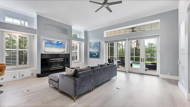 a living room with furniture a window and a fireplace