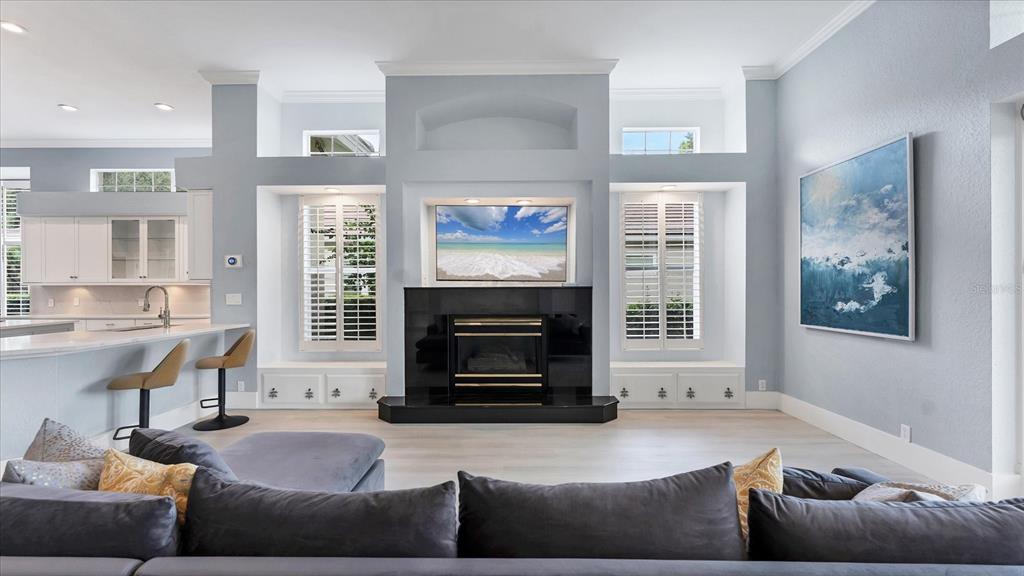 7217 Churston Lane University Park, FL 34201 - Photo 9 of 60 a living room with furniture a window and a fireplace