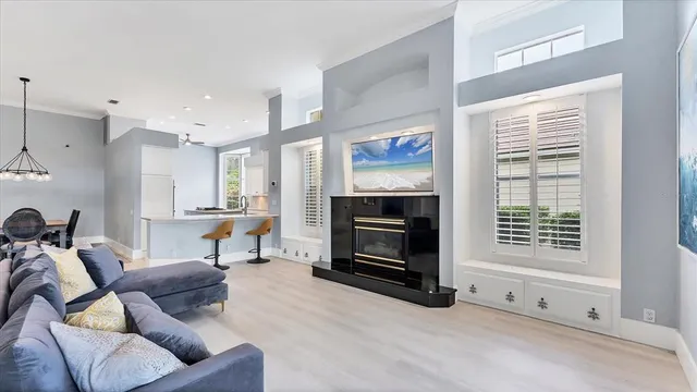 a living room with furniture and kitchen view