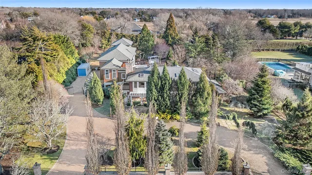aerial view of a house with a yard
