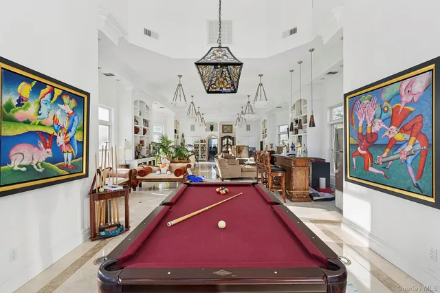 a room with lots of furniture and wooden floor