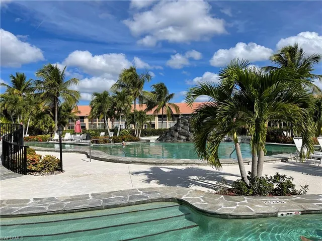 a view of a park with large trees