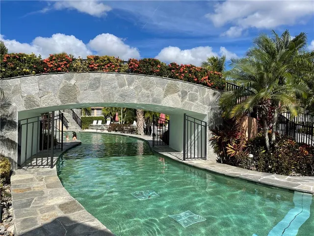 a view of a house with a backyard and garden