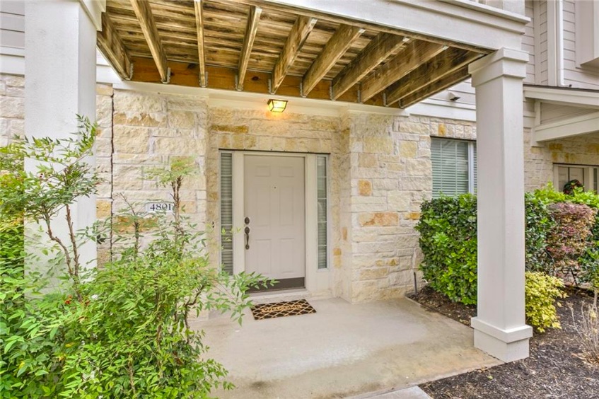 front view of a house with a potted plant