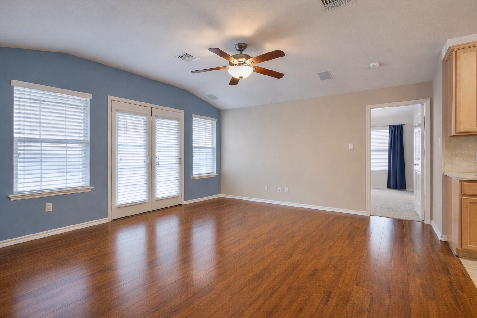 1900 Scofield Ridge Parkway, Unit 4801 Austin, TX 78727 - Photo 15 of 15 a view of an empty room with wooden floor and a window