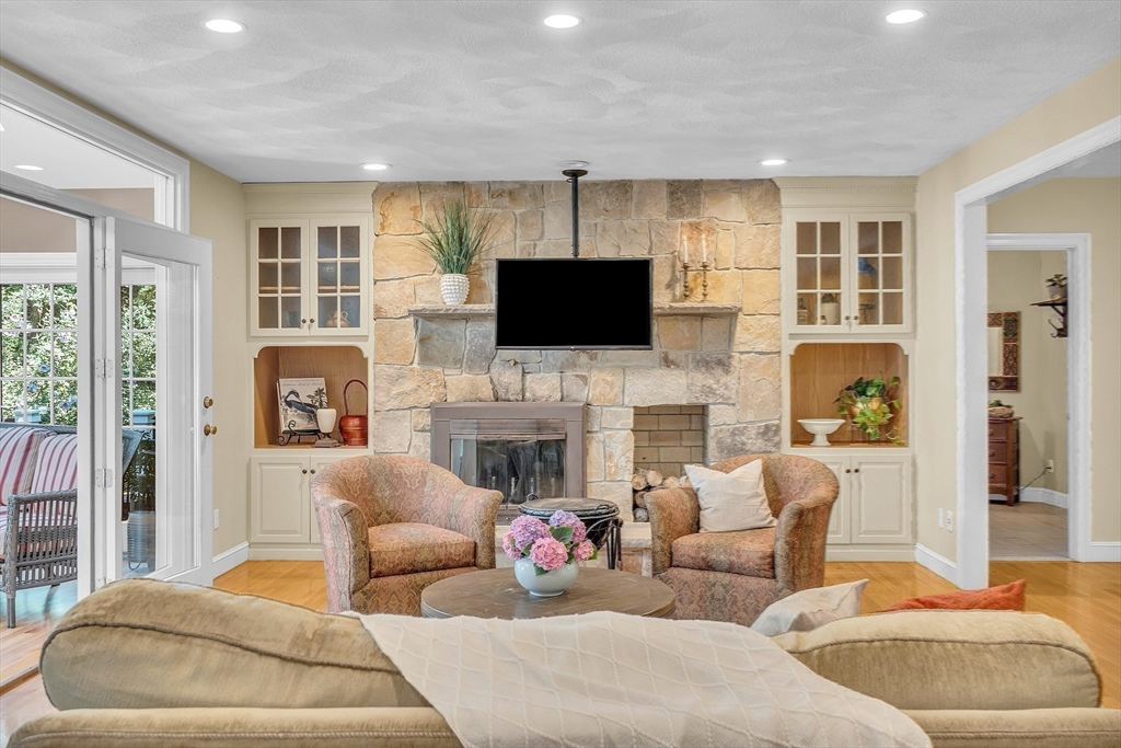 157 Lancaster Road North Andover, MA 01845 - Photo 13 of 42 a living room with fireplace furniture and a flat screen tv